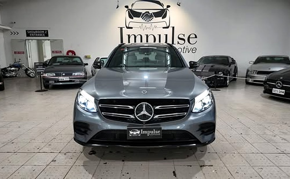 A detailed grey Mercedes-Benz on the floor at Impulse Automotive