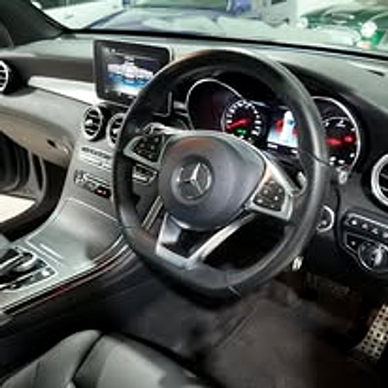 Steering wheel and dash detail of a car for sale
